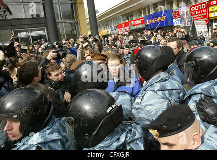 Riot police OMON arresting participants of the `Dissenters` March in Moscow. Former Putin`s adviser Andrei Illarionov (centre, wearing blue overcoat)participated in the March. Stock Photo